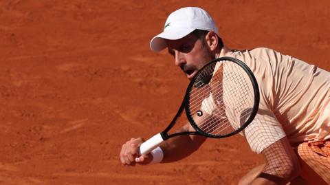 Novak Djokovic hits a forehand