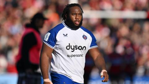 Beno Obano standing on the field during Bath's game at Gloucester