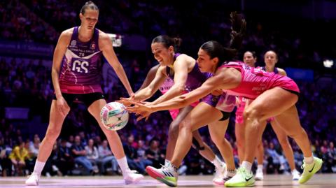 Nat Panagarry of Loughborough Lightning reaches for the ball with Zara Everitt