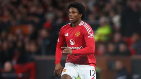 Tyrell Malacia playing for Manchester United