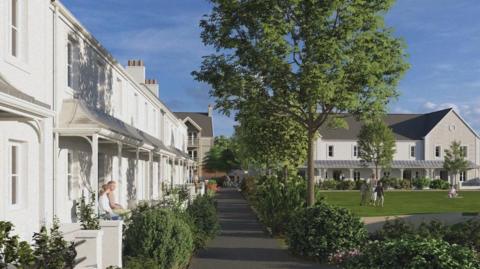 A residential neighbourhood with grey/white houses featuring porches and chimneys. A tree-lined pathway runs through the cente, bordered by green bushes and plants. People are seen enjoying the outdoors, with some sitting on porches and others walking or standing on a grassy area in front of a larger building in the background.