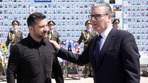 Prime Minister Sir Keir Starmer and Ukrainian President Volodymyr Zelensky at the Wall of Remembrance of the Fallen for Ukraine on Mykhailivs'ka Square, Kyiv, on 16July 2026