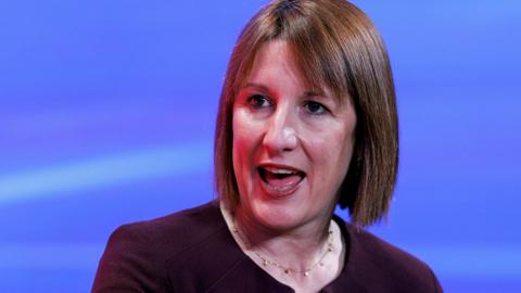 Rachel Reeves headshot with close cropped straight shoulder length hair as she looks away from camera while speaking at an investment summit event  in London on 14 October