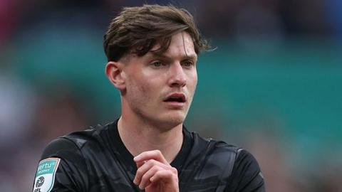 Taylor Gardner-Hickman, with the ball in his arms, prepares to take a throw in for Birmingham City