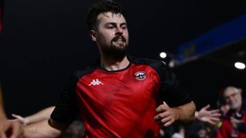 Billy Palfrey celebrates scoring for Truro