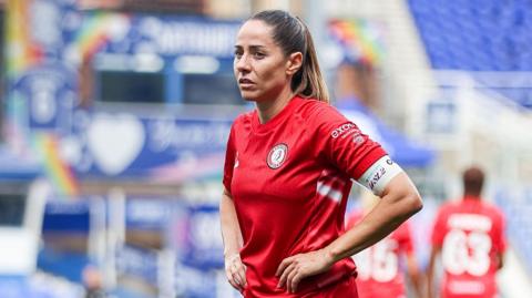 Vicky Losada with her hands on her waist while standing on the pitch during a Bristol City match