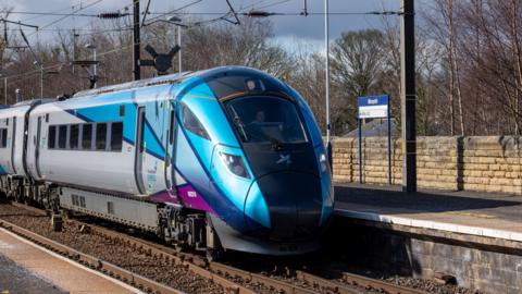 A TransPennine train pulling into Morpeth 