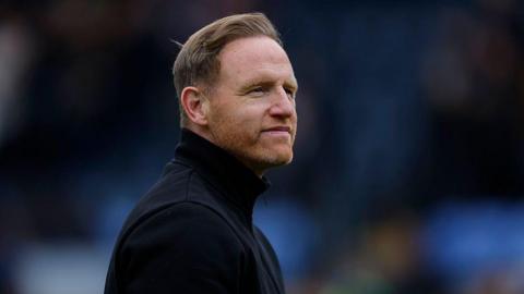 Shrewsbury Town manager Gavin Cowan looks on during a League Two match
