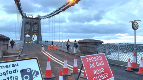 Closed Menai suspension bridge with road closed sign 