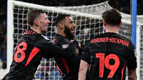 Keshi Anderson of Birmingham City celebrates with team-mates after scoring the team's first goal