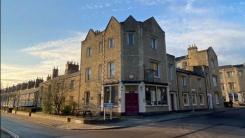 The Cricketers Pub building on the corner of a street.