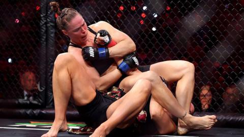 Ronda Rousey gets an armbar on Gina Carano