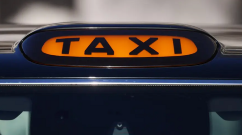 Stock shot of the taxi light of a car.