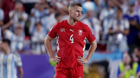 Nico Elvedi of Switzerland looks on