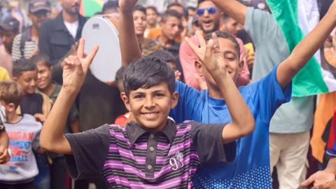 Boy celebrating deal in Gaza