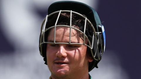 South Africa batter Lhuan-dre Pretorius with his helmet grille lifted above his eyes