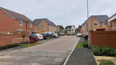 A general view of Leveret Gardens in Stowmarket. Cars can be seen parked outside homes.