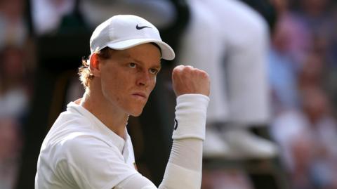 Jannik Sinner celebrates winning a point against Carlos Alcaraz in the Wimbledon final