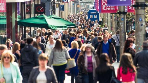 A crowded street of people