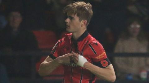 Nathan Lowe celebrates his equaliser for Walsall