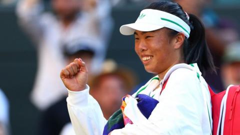 Mimi Xu pumps her fist after the end of a game