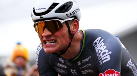 Dutch rider Mathieu van der Poel grimaces after winning the 2025 E3 Saxo Bank Classic