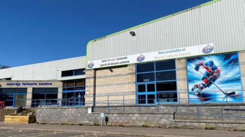 Moray Leisure Centre building, with an image of an ice hockey player outside. 
