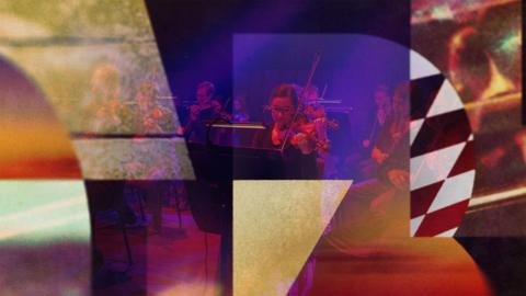 The BBC Philharmonic Orchestra perform surrounded by The Music is Black branding