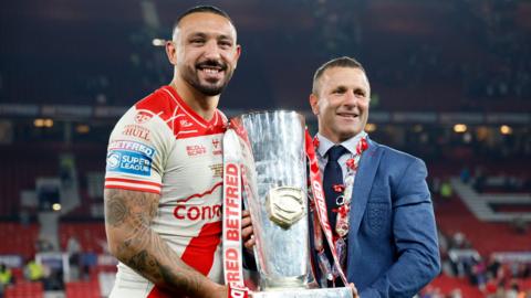 Hull KR captain Elliot Minchella and head coach Willie Peters with the Super League trophy