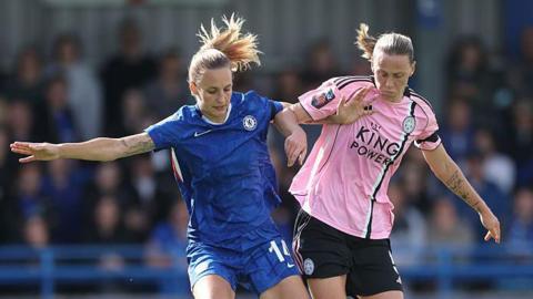 Nathalie Bjoern of Chelsea is challenged by Emily van Egmond of Leicester City