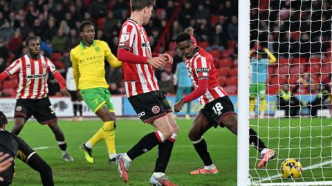 Djibril Soumare (number 18) scores an own goal for Norwich