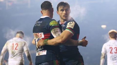 Josh Bassett celebrates scoring a try