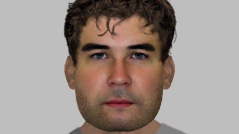 An E-fit of a youngish man with dark hair and stubble