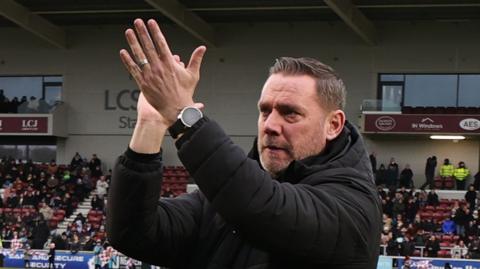 Kevin Nolan claps supporters