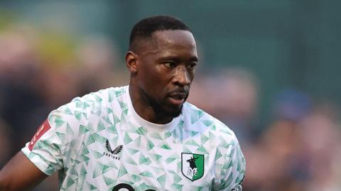 Lucas Akins in action for Mansfield Town