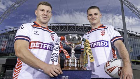 George Williams and Jack Welsby with the Rugby League Ashes trophy outside Wembley Stadium