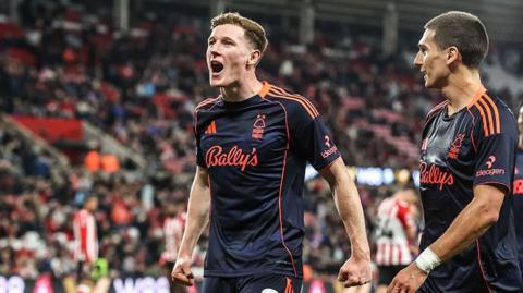 Elliot Anderson celebrates