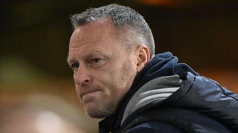 Cheltenham boss Michael Flynn looks on from the touchline