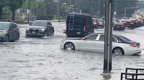 Car partially submerged in water.