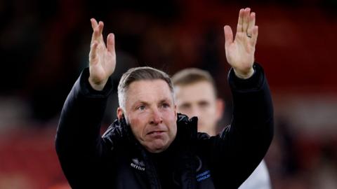 Neil Harris applauds the Millwall fans after the Championship match at Middlesbrough