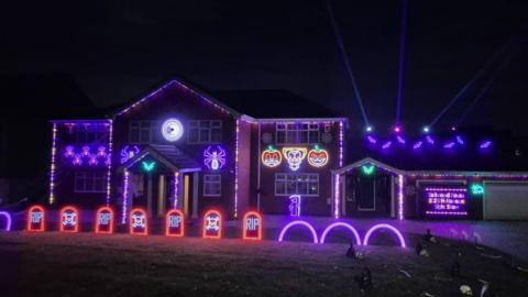 The image shows the house with the lights 