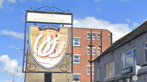 The Three Horse Shoes pub sign