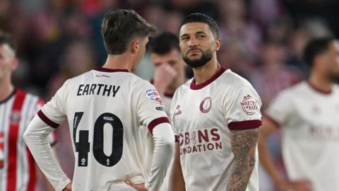 Nahki Wells (right) on the pitch following defeat by Sheffield United