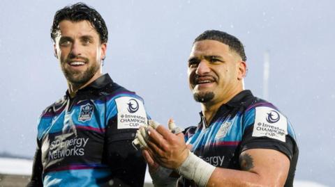 Adam Hastings and Sione Tuipulotu celebrate Glasgow's victory over Bulls