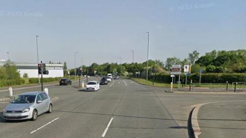 A street view of the junction turning to Sunbank Lane off Wilmslow Road