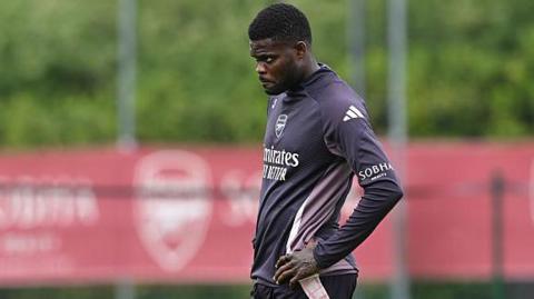 Thomas Partey with his hands on his hips during Arsenal training