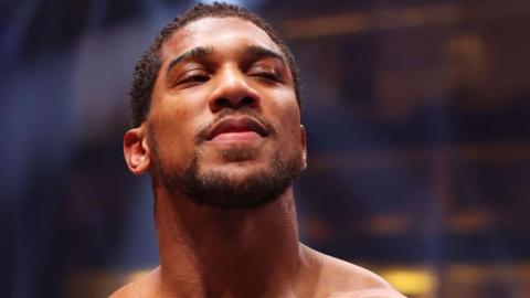 Anthony Joshua smiles after beating Francis Ngannou