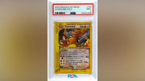 A mint condition Pokemon Skyridge Charizard Holo.