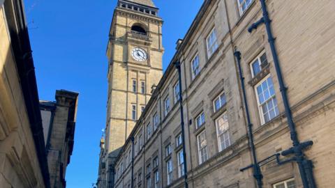 Wakefield Town Hall - a large, sandy coloured brick building with a tall clocktower.
