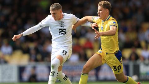 Port Vale's Ronan Curtis dribbles away from Gillingham's Sam Gale